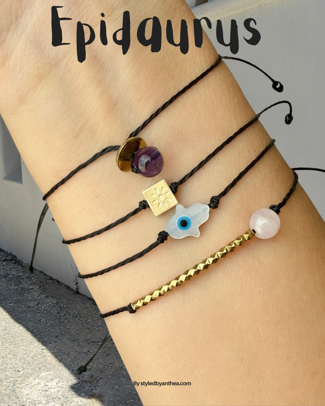 Multiple bracelets with various charms on a wrist, branded 'Epidaurus'. 